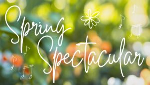 Spring Spectacular in a white script font over blurred photo of flowers
